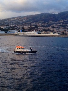 Madiera =  LAST LAND - - as the tug takes our big boat out to sea…..